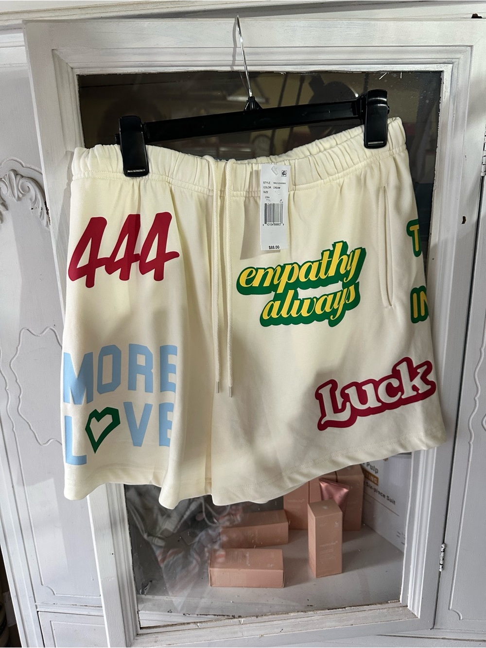 Cream Graphic Athletic Shorts with Positive Slogans